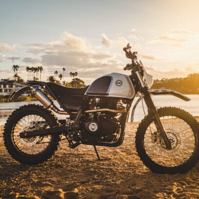 Schlachtwerk's Royal Enfield Himalayan Enduro Custom on a beach at sunset in Sydney