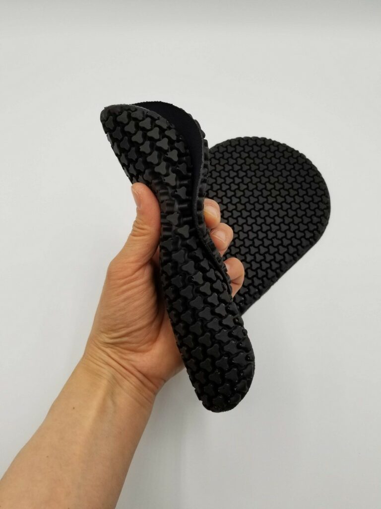 Hand holding flexible CE level 1 armor pad