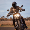 Front view of man riding motorcycle