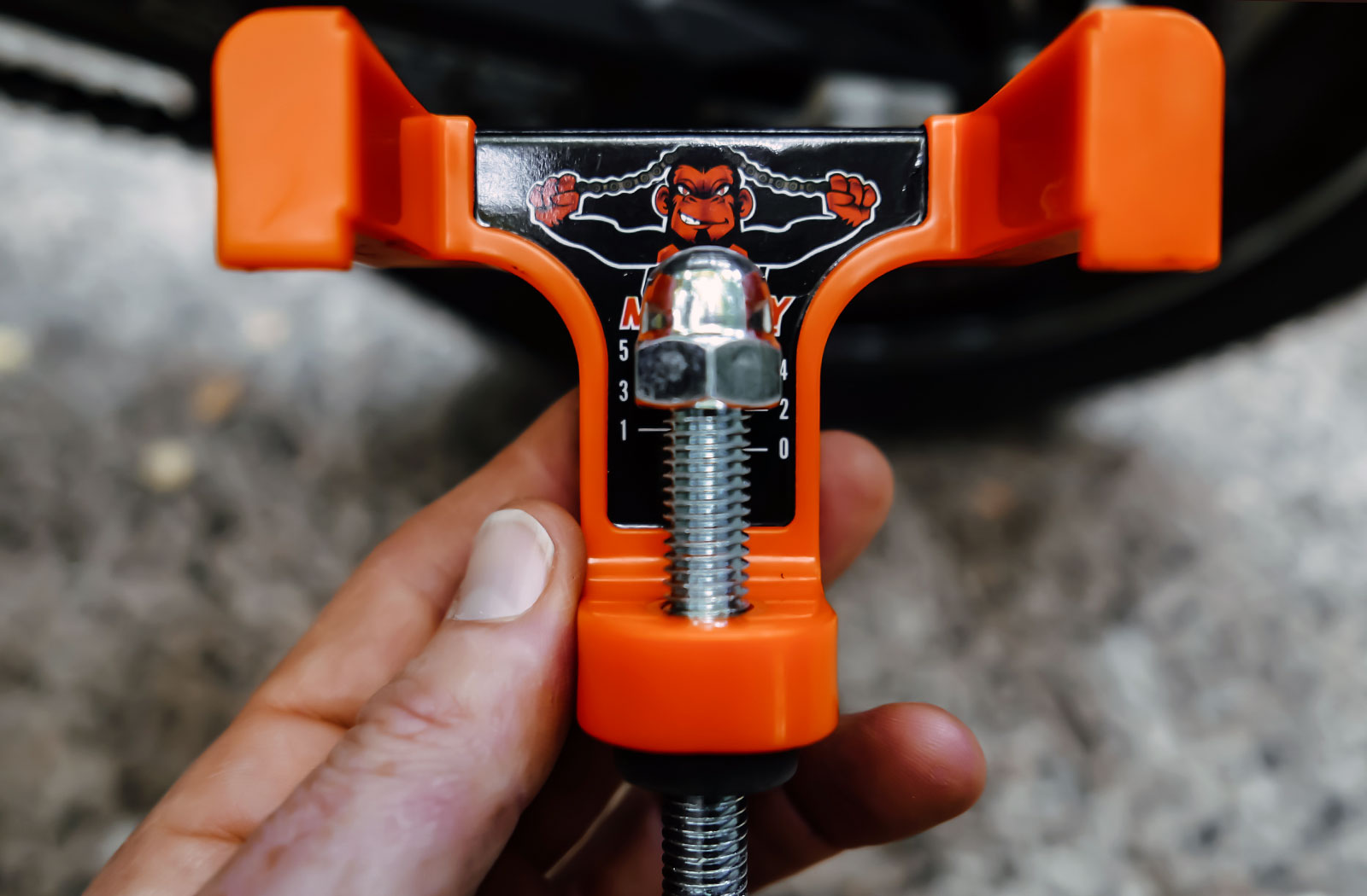 DIY motorcycle chain tension adjustment tool